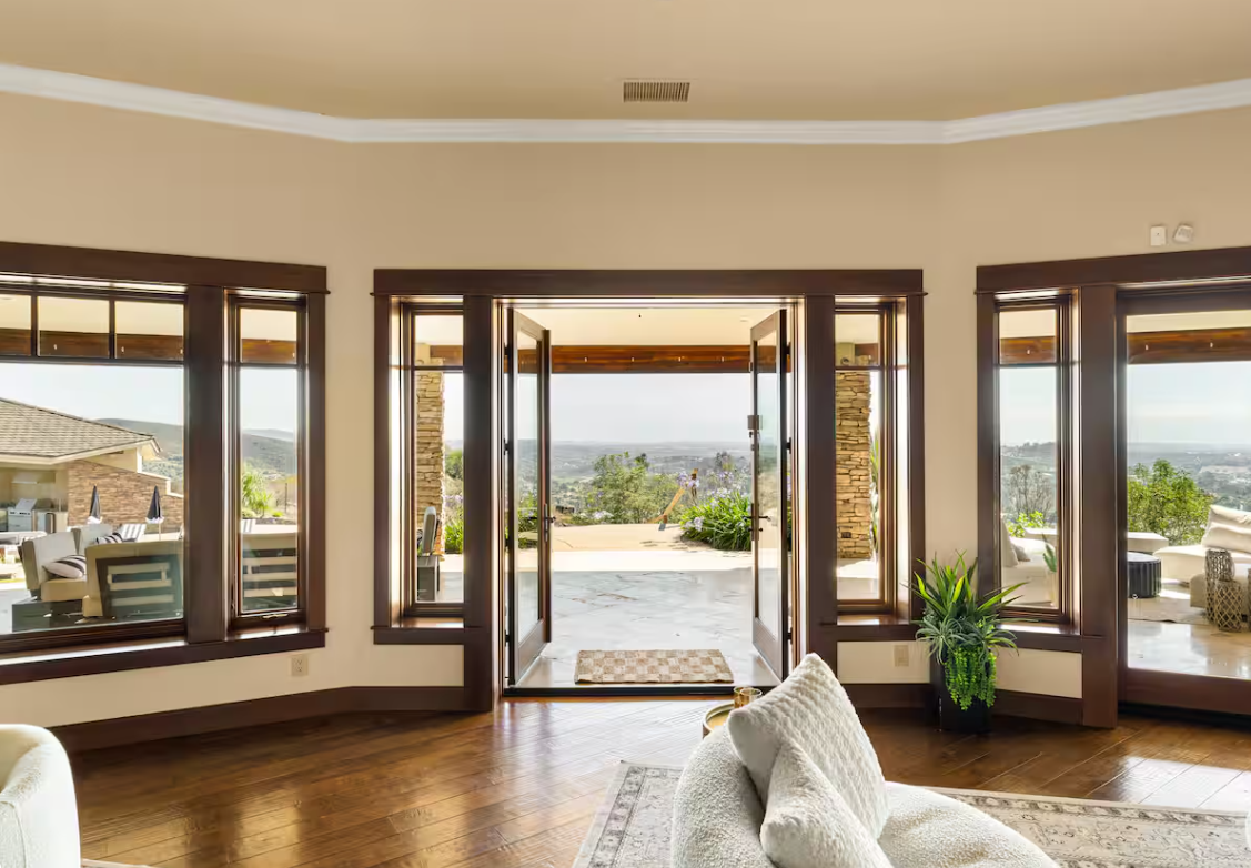 French doors opening to the valley and ocean view veranda
